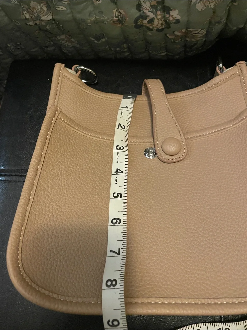 Women's Tan Crossbody with Perforated Oval H Detail. Closet clear out.